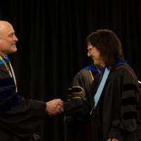 Faculty shaking hands